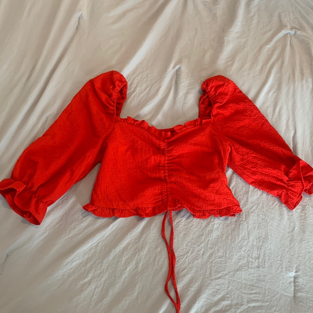 Cropped red quarter sleeve ruffle top